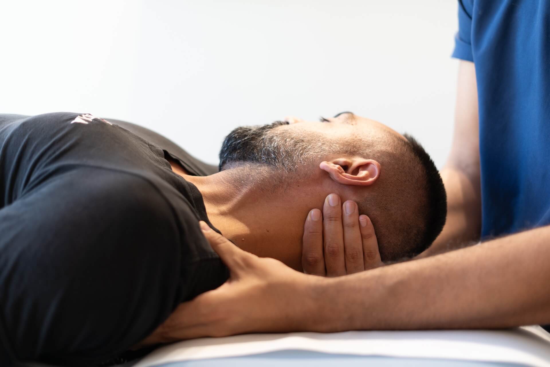 KINETIKA therapist performing manual therapy technique
