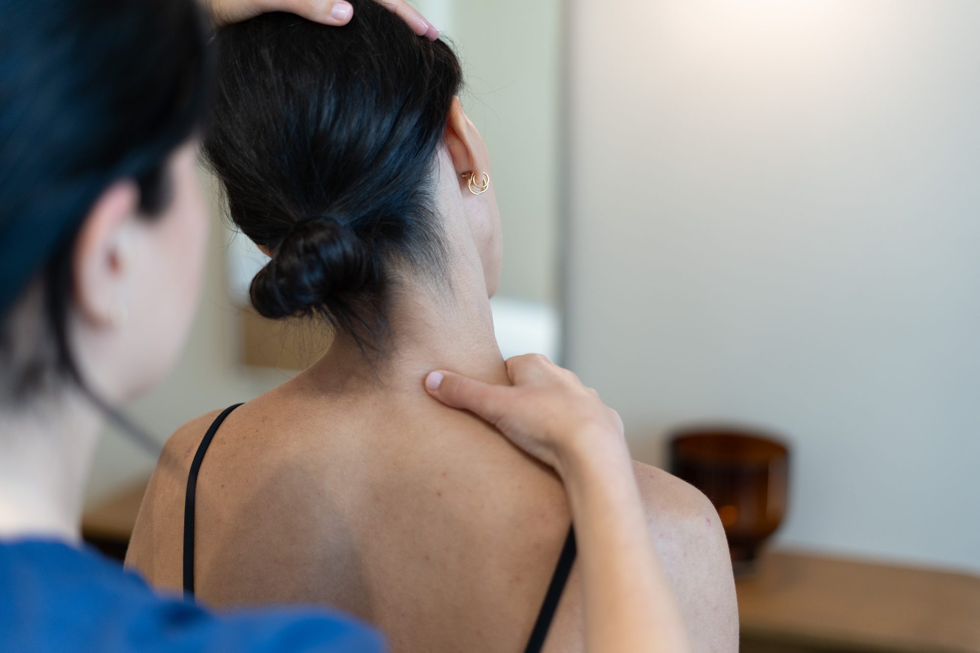 Kinetika physiotherapist treating a patient with neck pain at Kinetika Dubai