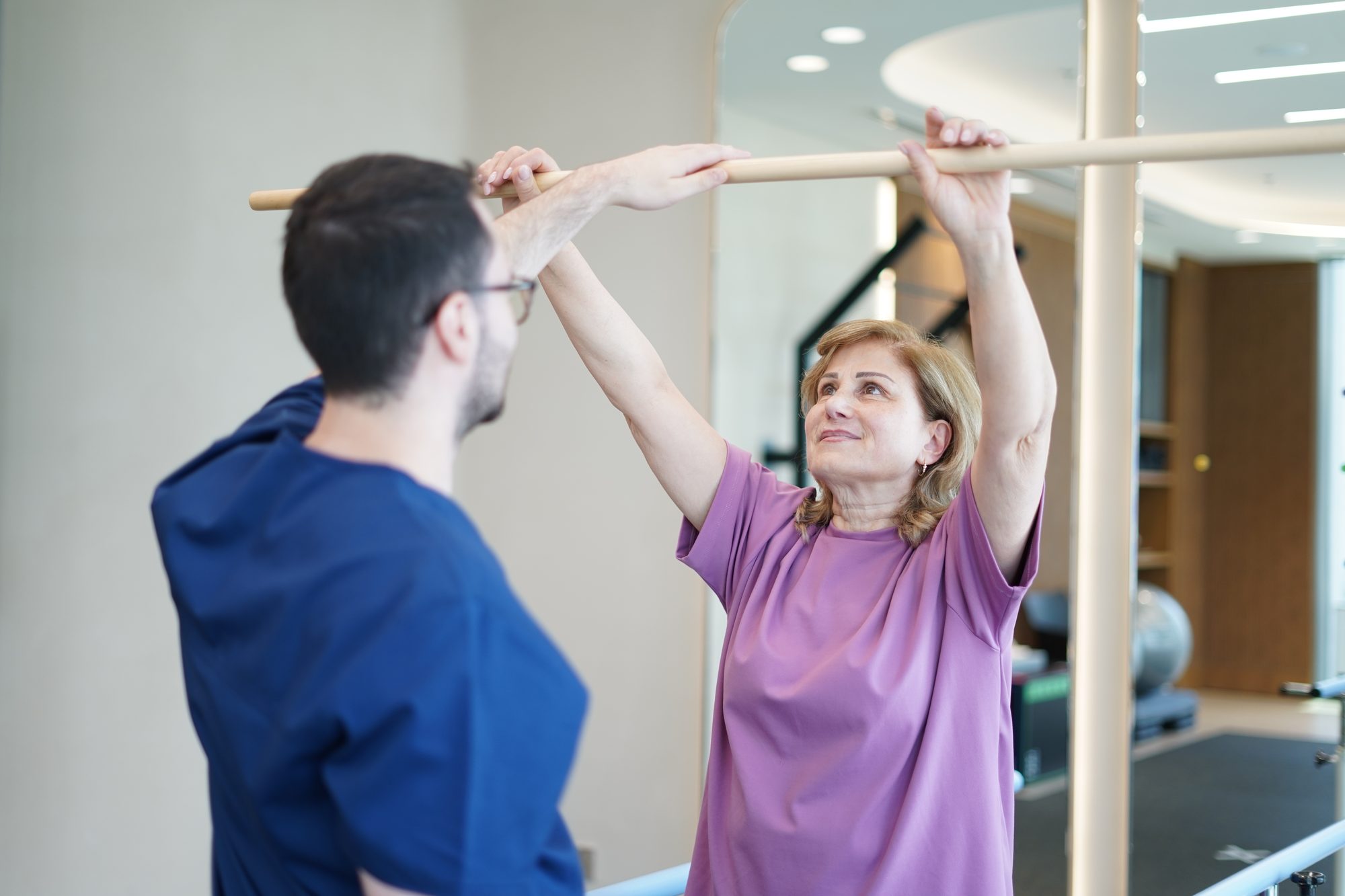 Kinetika physiotherapist treating a patient with poor posture at Kinetika Dubai