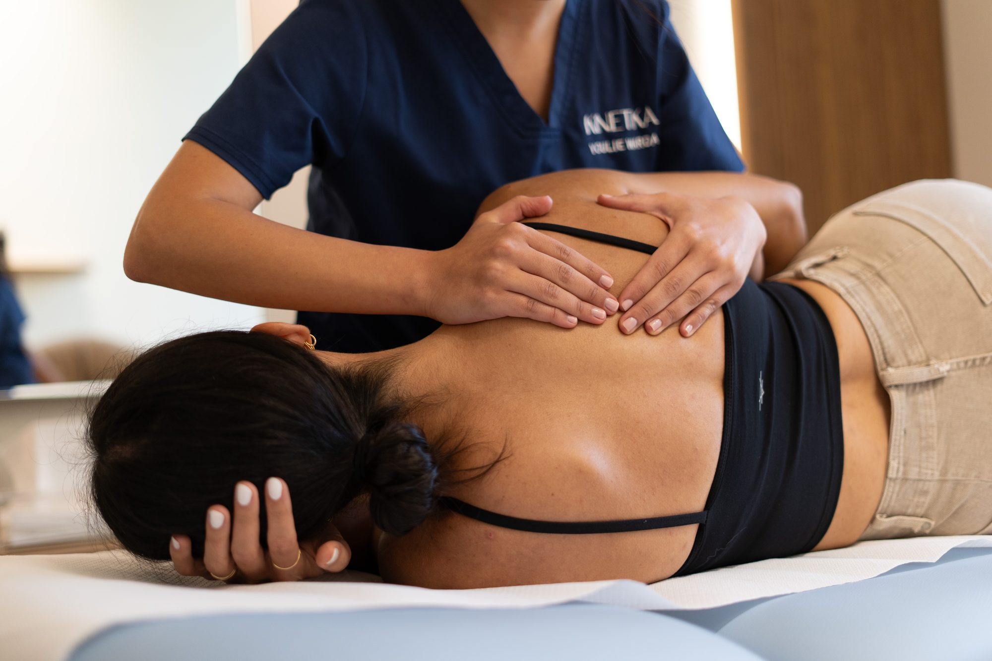 Kinetika physiotherapist treating a patient with shoulder pain at Kinetika Dubai
