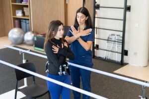 Physiotherapist guiding a standing balance test during a vestibular assessment at KINETIKA Dubai Hills